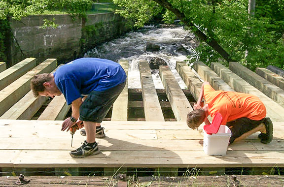 Photo of volunteers working on the Mascoma River Greenway Rail Trail.